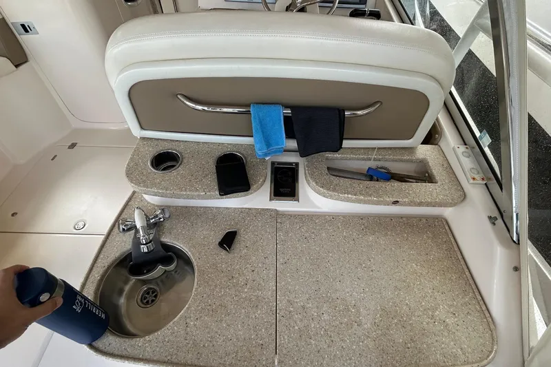  Yacht Photos Pics Interior of a 2013 Grady-White Freedom 335 boat with sink and countertop.