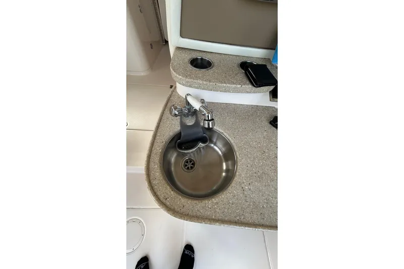  Yacht Photos Pics 2013 Grady-White Freedom 335 boat sink with countertop and faucet.