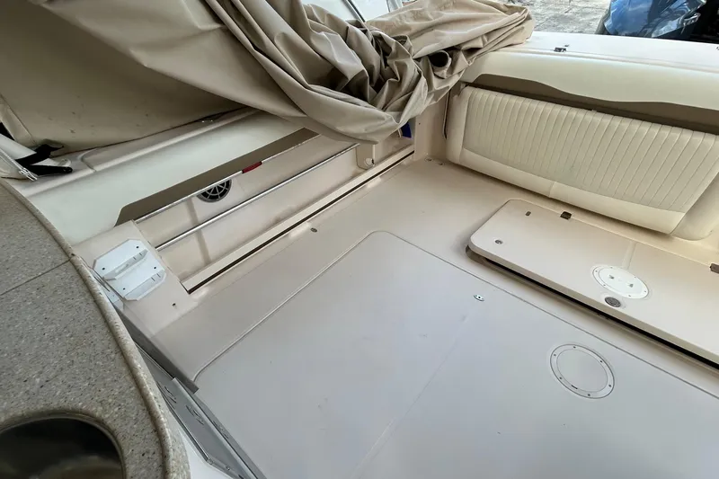  Yacht Photos Pics 2013 Grady-White Freedom 335 boat interior with seating and storage compartments.