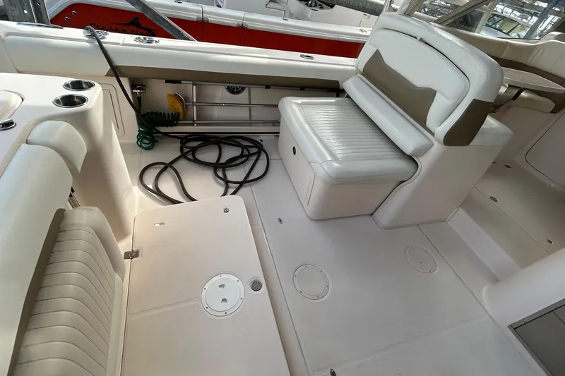  Yacht Photos Pics 2013 Grady-White Freedom 335 boat interior with seating and storage compartments.
