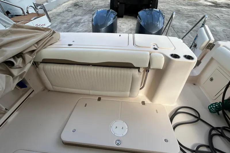  Yacht Photos Pics 2013 Grady-White Freedom 335 boat interior with seating and storage compartments.