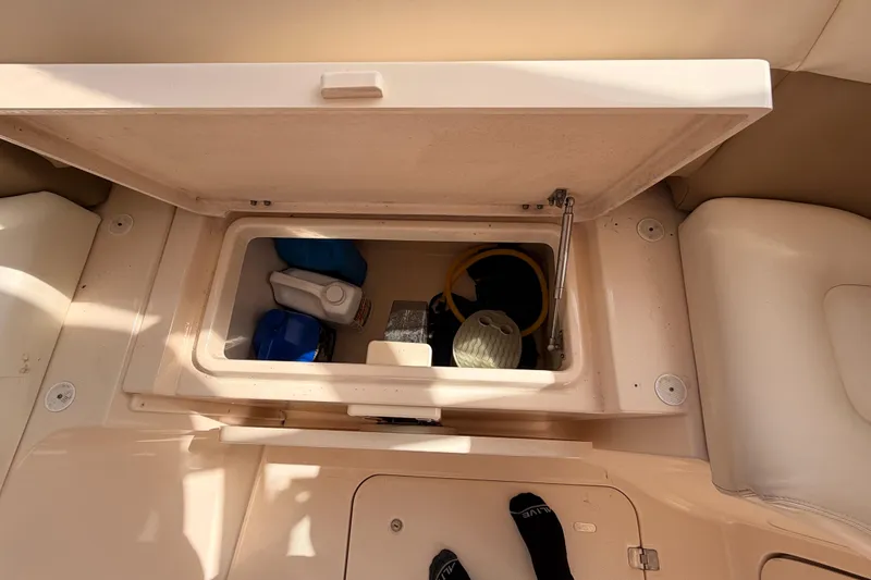  Yacht Photos Pics Storage compartment on a 2013 Grady-White Freedom 335 boat, containing various items.