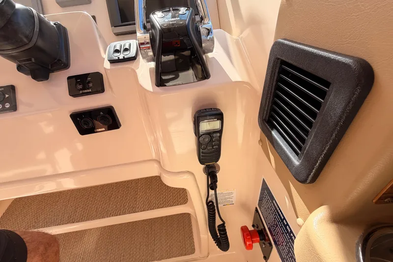  Yacht Photos Pics 2013 Grady-White Freedom 335 boat dashboard with controls and communication device.