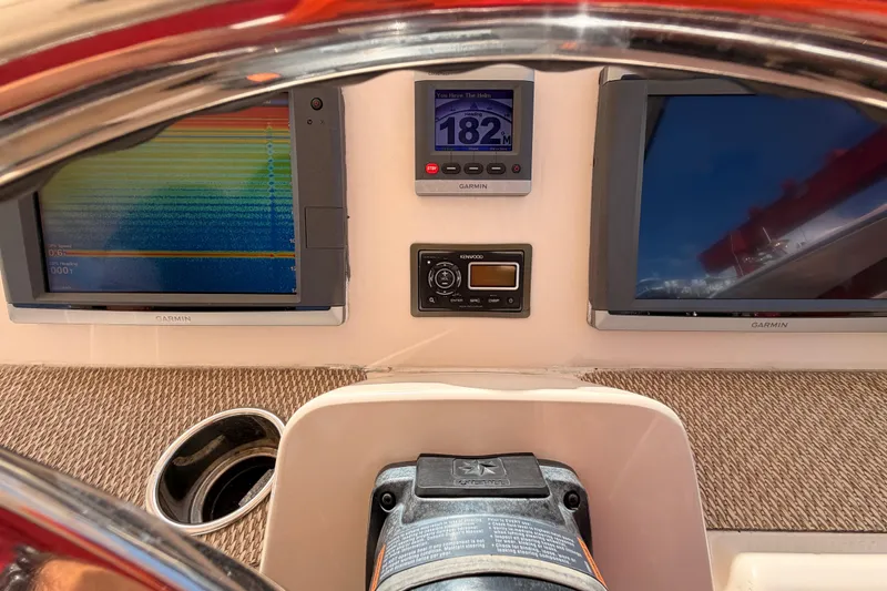  Yacht Photos Pics Dashboard of 2013 Grady-White Freedom 335 with Garmin displays and Kenwood audio system.