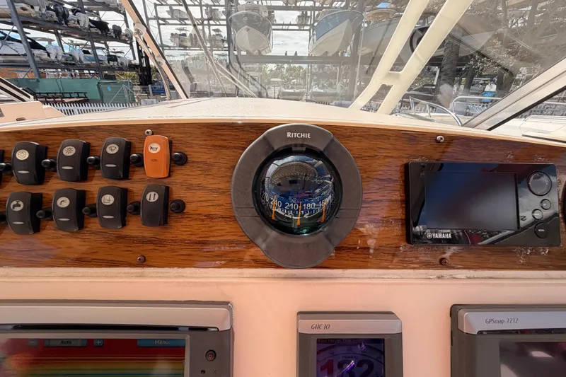  Yacht Photos Pics Dashboard of 2013 Grady-White Freedom 335 boat with compass and control panel.