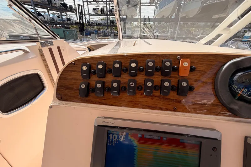  Yacht Photos Pics Dashboard of 2013 Grady-White Freedom 335 boat with control switches and GPS display.