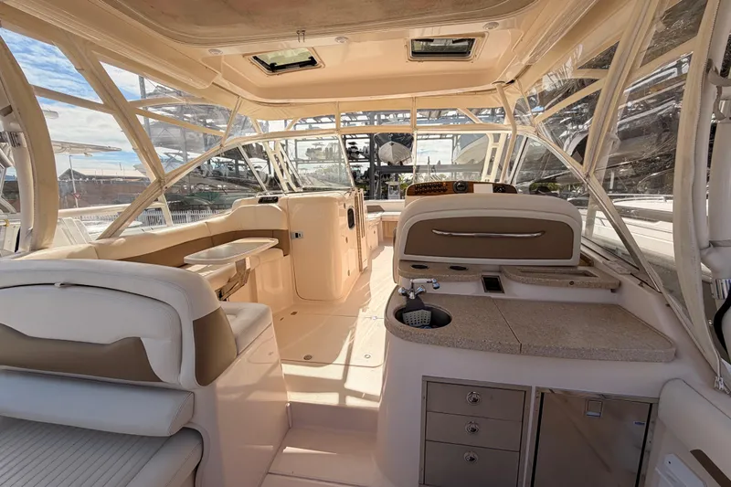  Yacht Photos Pics Interior of 2013 Grady-White Freedom 335 boat, featuring seating and helm area.