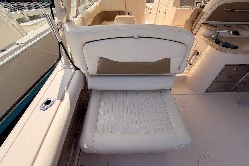  Yacht Photos Pics 2013 Grady-White Freedom 335 boat interior with beige seating and kitchenette area.