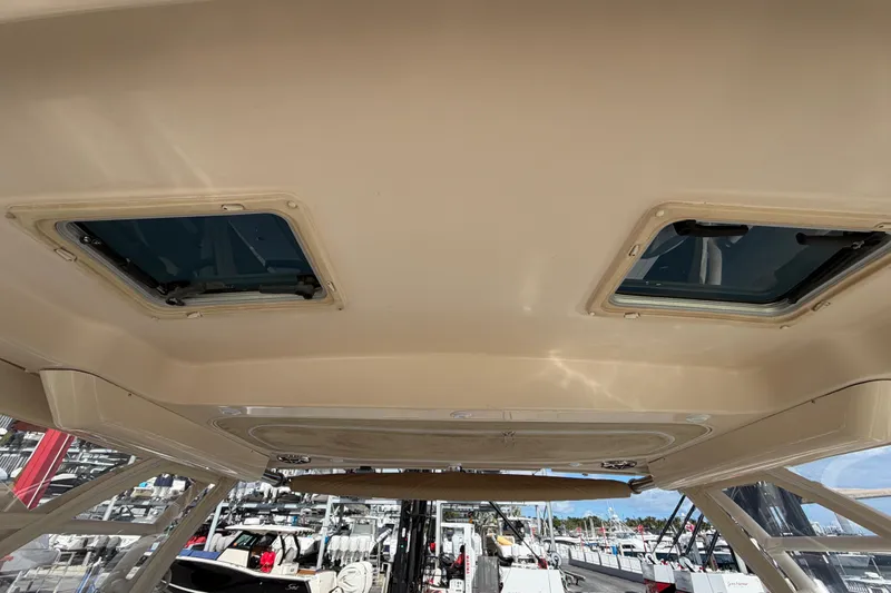  Yacht Photos Pics 2013 Grady-White Freedom 335 boat interior ceiling with skylights, docked at marina.