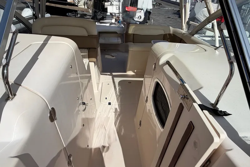  Yacht Photos Pics 2013 Grady-White Freedom 335 boat interior with seating and storage compartments.