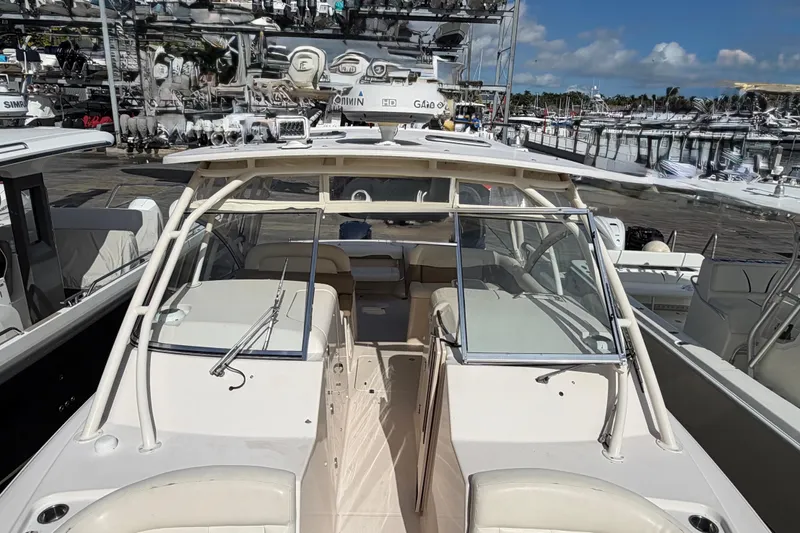  Yacht Photos Pics 2013 Grady-White Freedom 335 boat docked at a marina under clear skies.
