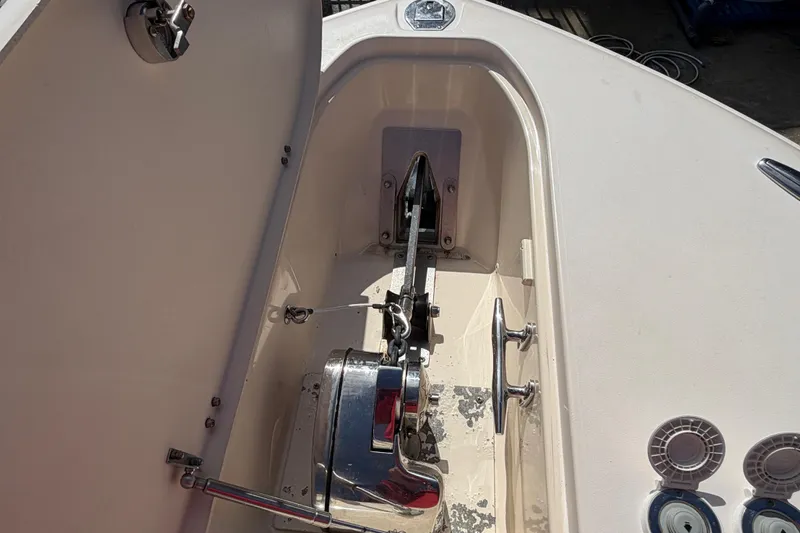  Yacht Photos Pics Anchor compartment of 2013 Grady-White Freedom 335 boat, featuring winch and cleats.