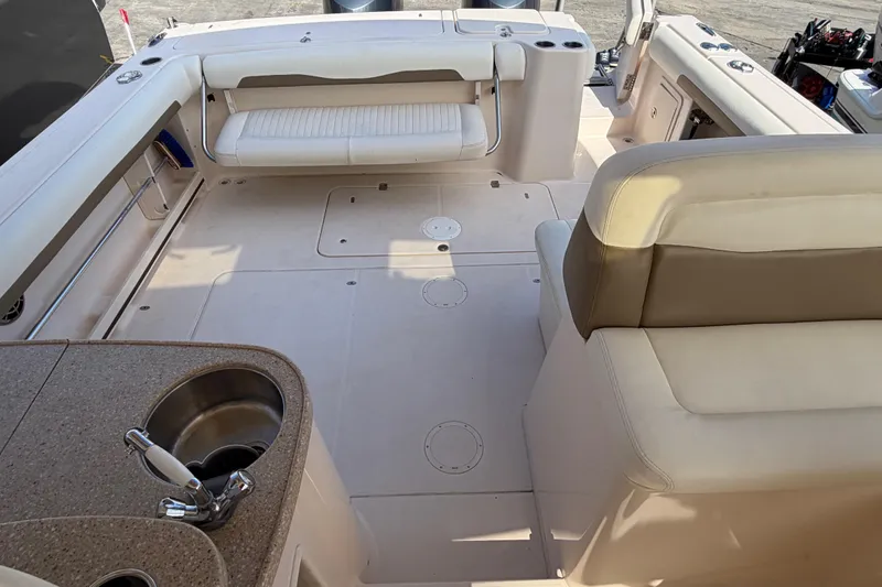  Yacht Photos Pics 2013 Grady-White Freedom 335 boat interior with seating and sink area.