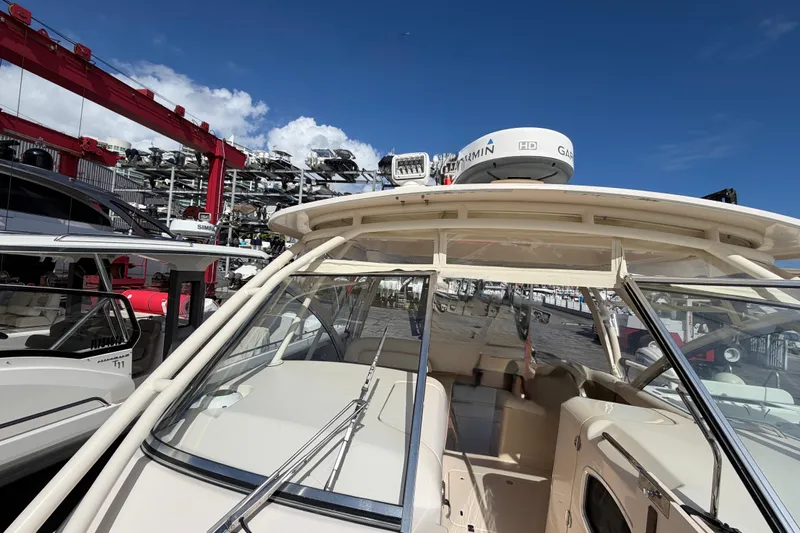  Yacht Photos Pics 2013 Grady-White Freedom 335 boat docked under clear blue sky.