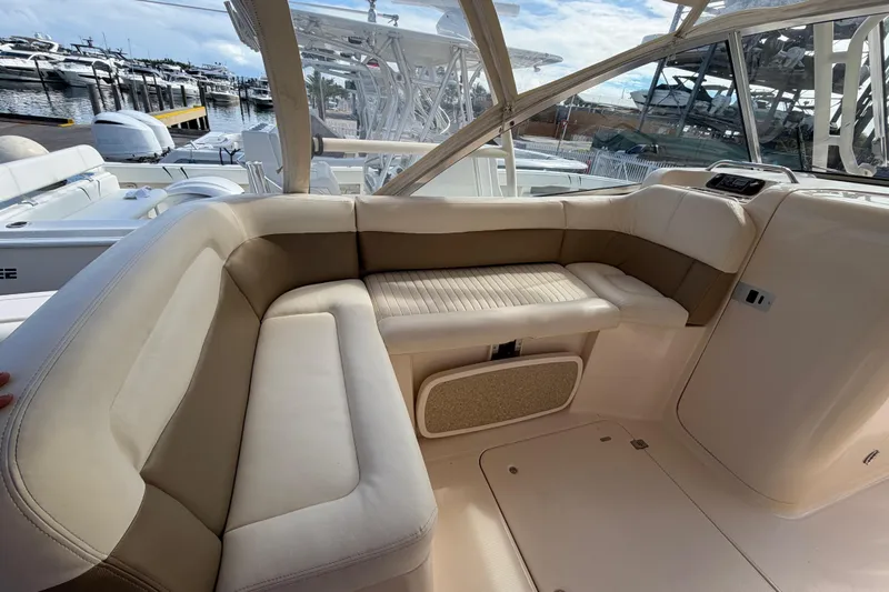  Yacht Photos Pics Luxurious seating area on a 2013 Grady-White Freedom 335 boat, docked at a marina.