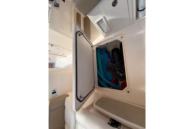  Yacht Photos Pics 2013 Grady-White Freedom 335 storage compartment with boating accessories.