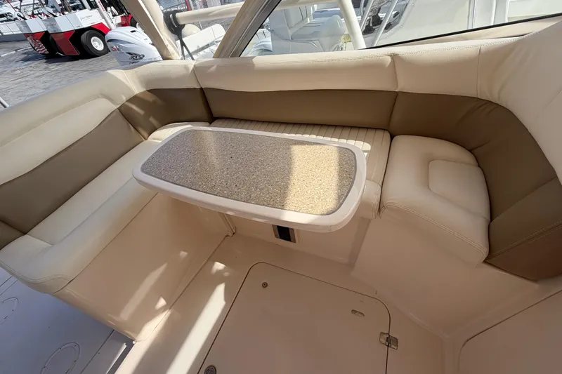  Yacht Photos Pics 2013 Grady-White Freedom 335 boat interior with cushioned seating and table.