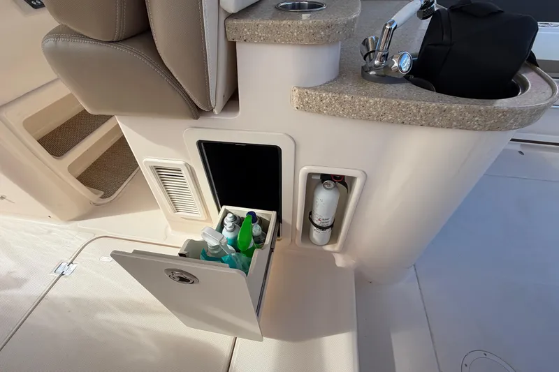  Yacht Photos Pics 2013 Grady-White Freedom 335 boat interior with storage compartments and sink area.