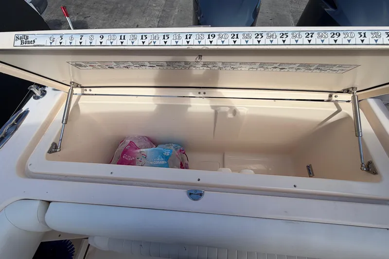  Yacht Photos Pics Open storage compartment on 2013 Grady-White Freedom 335 boat with measuring scale.