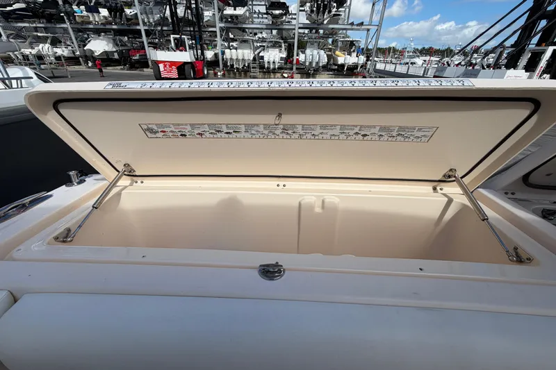  Yacht Photos Pics Open storage compartment on a 2013 Grady-White Freedom 335 boat, dockside view.