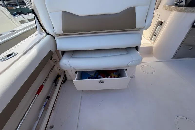  Yacht Photos Pics 2013 Grady-White Freedom 335 boat interior with open storage drawer.
