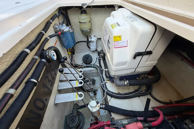  Yacht Photos Pics Engine compartment of a 2013 Grady-White Freedom 335 boat, showing mechanical components and wiring.
