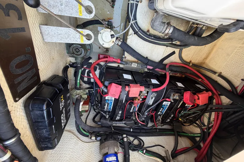  Yacht Photos Pics Battery compartment of a 2013 Grady-White Freedom 335 boat with wiring and components.