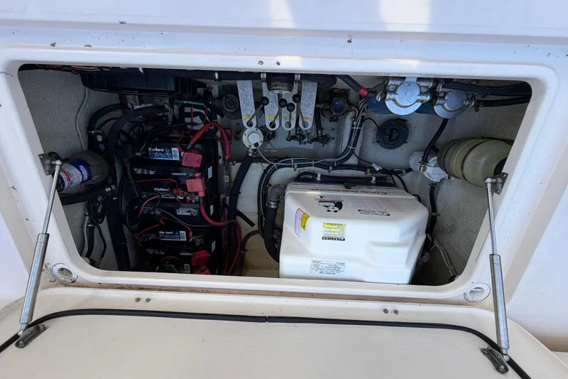  Yacht Photos Pics Engine compartment of 2013 Grady-White Freedom 335 boat, showing batteries and generator.