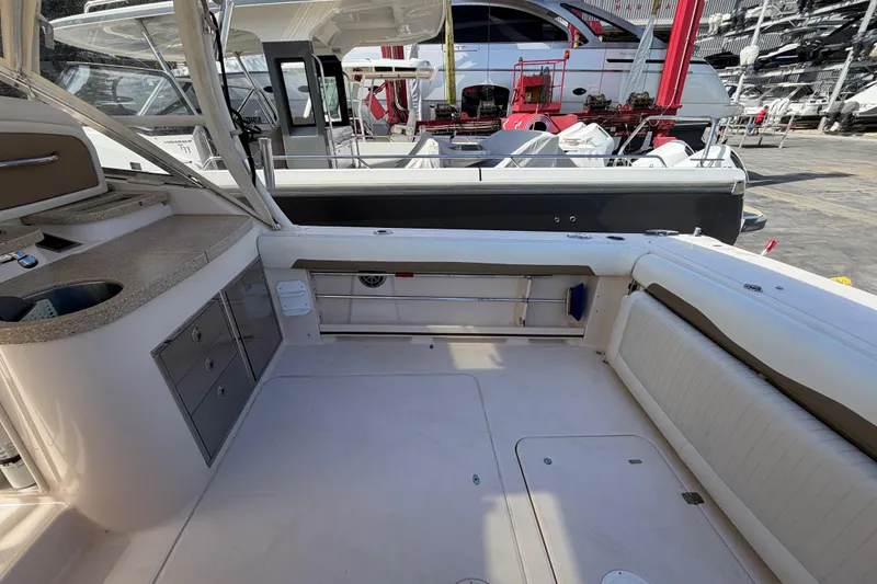  Yacht Photos Pics 2013 Grady-White Freedom 335 boat interior with seating and storage compartments.