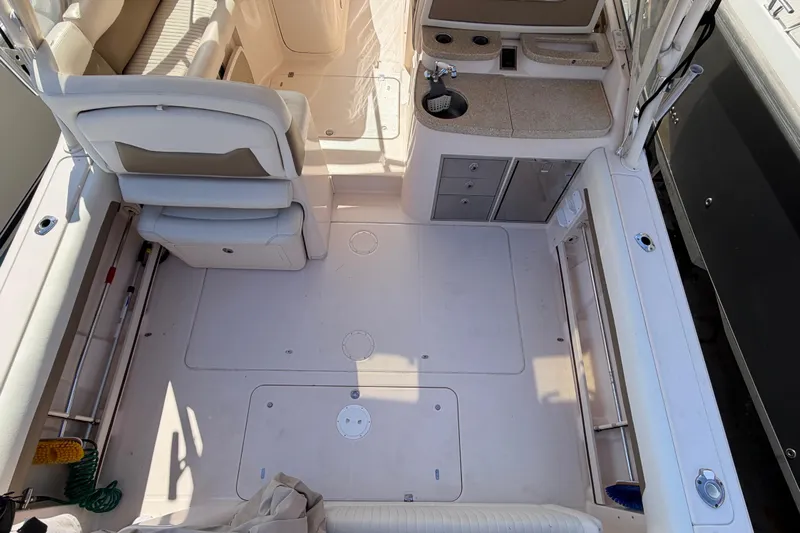  Yacht Photos Pics 2013 Grady-White Freedom 335 boat interior with seating and storage compartments.