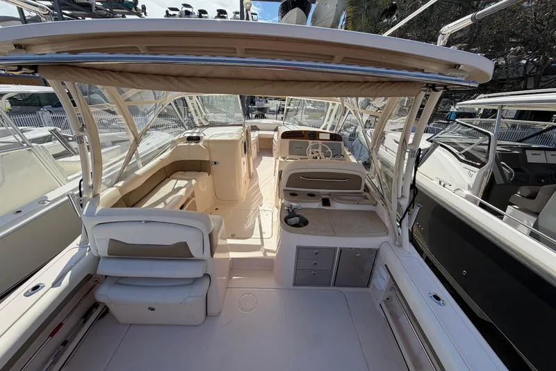  Yacht Photos Pics 2013 Grady-White Freedom 335 boat interior with seating and helm station.