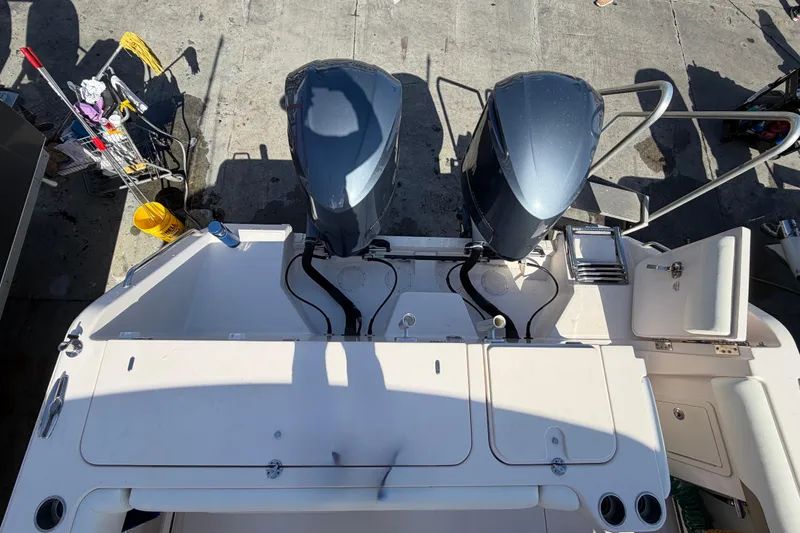  Yacht Photos Pics 2013 Grady-White Freedom 335 boat with dual outboard engines at dockside.