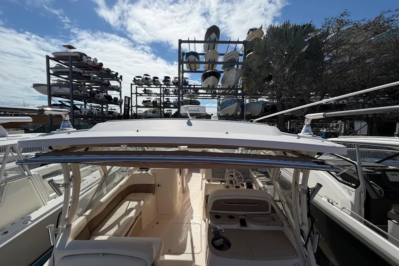  Yacht Photos Pics 2013 Grady-White Freedom 335 boat docked with stacked boats in background.