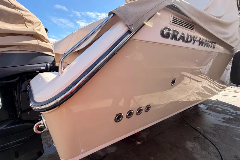  Yacht Photos Pics 2013 Grady-White Freedom 335 boat, rear view with cover, on dry dock.