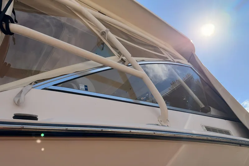  Yacht Photos Pics 2013 Grady-White Freedom 335 boat under bright sun, showcasing sleek design and windows.