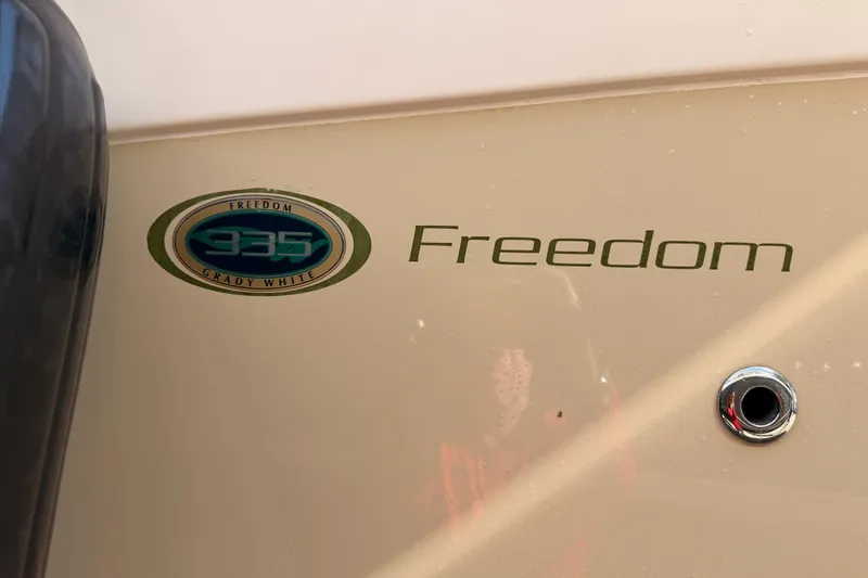  Yacht Photos Pics 2013 Grady-White Freedom 335 boat logo and emblem on hull.