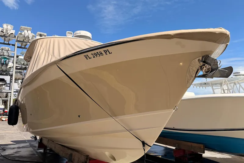  Yacht Photos Pics 2013 Grady-White Freedom 335 boat docked under clear blue sky.