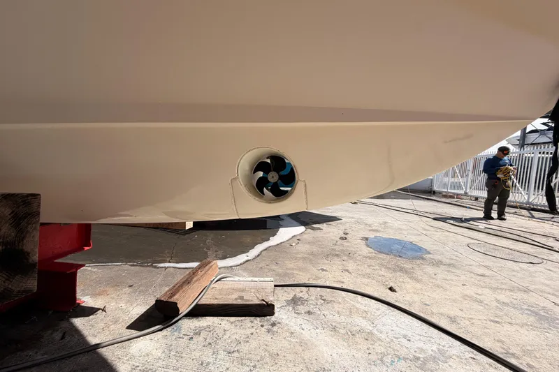  Yacht Photos Pics 2013 Grady-White Freedom 335 boat hull with visible thruster in a shipyard.