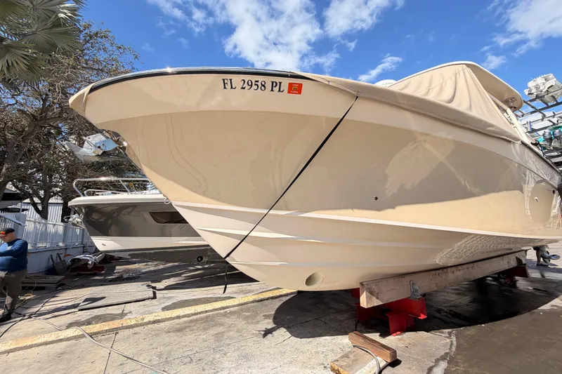  Yacht Photos Pics 2013 Grady-White Freedom 335 boat on dry dock, sunny day, clear sky.