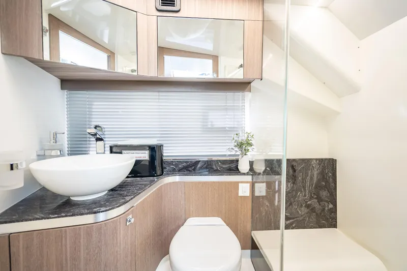  Yacht Photos Pics Luxurious bathroom interior of 2023 Galeon 375 GTO yacht with modern fixtures and elegant design.