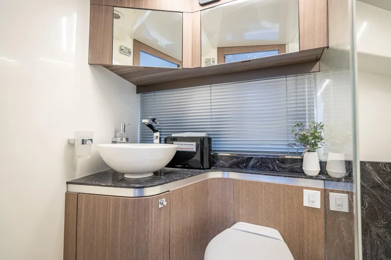  Yacht Photos Pics Modern bathroom interior in 2023 Galeon 375 GTO yacht with sleek fixtures and elegant design.