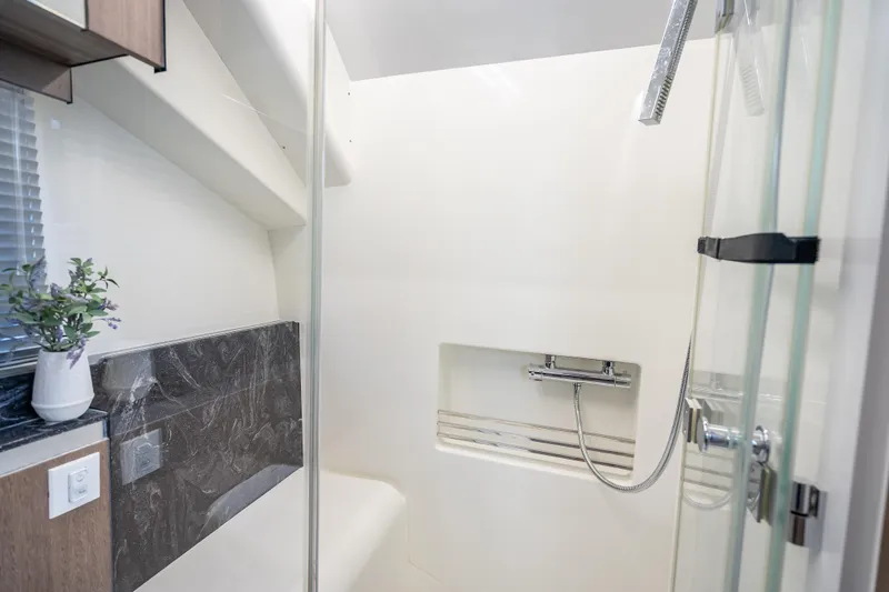  Yacht Photos Pics Modern bathroom interior on 2023 Galeon 375 GTO yacht, featuring sleek shower design.