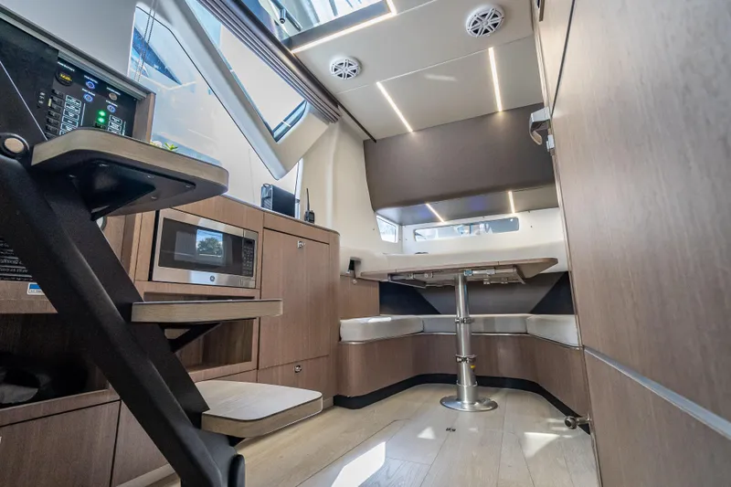  Yacht Photos Pics Interior of 2023 Galeon 375 GTO yacht with modern kitchen and seating area.