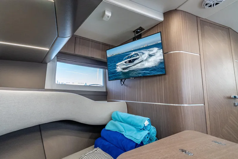  Yacht Photos Pics Interior of 2023 Galeon 375 GTO yacht with TV and folded towels.