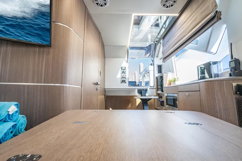  Yacht Photos Pics Luxurious interior of 2023 Galeon 375 GTO yacht with modern wood finishes and sleek design.