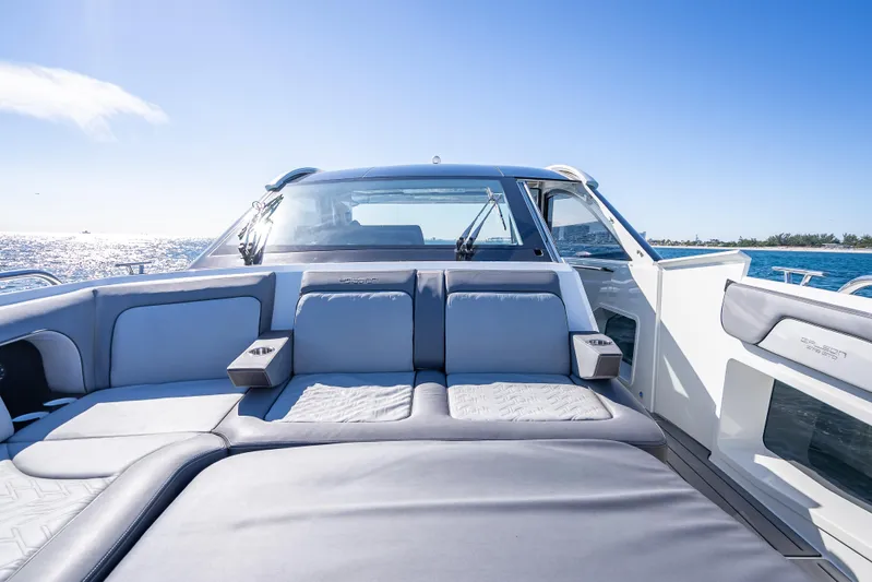  Yacht Photos Pics 2023 Galeon 375 GTO luxury yacht interior with plush seating, ocean view, and clear blue sky.