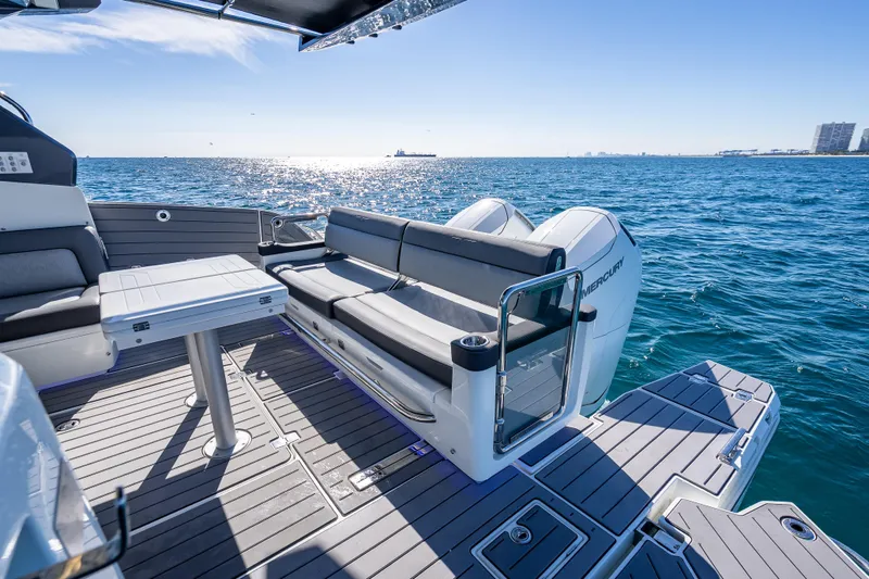  Yacht Photos Pics 2023 Galeon 375 GTO luxury yacht deck with seating, table, and ocean view.