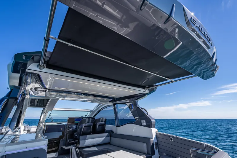  Yacht Photos Pics 2023 Galeon 375 GTO yacht interior with open canopy, ocean view.