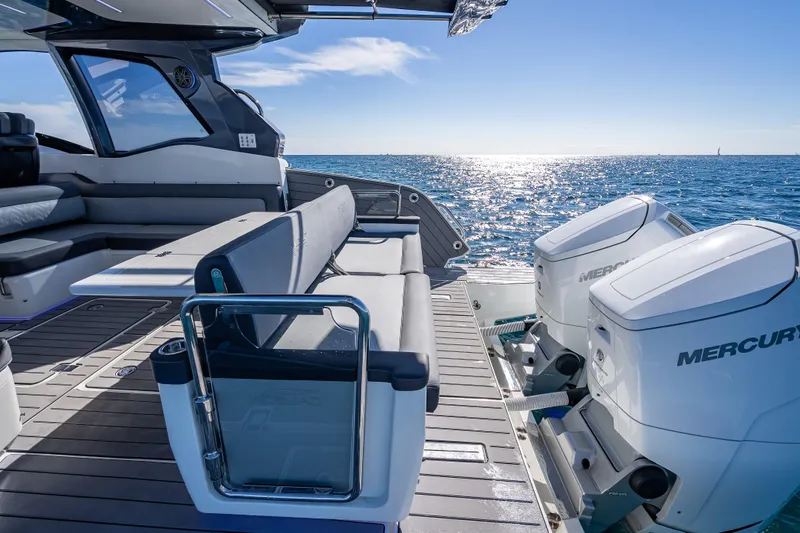  Yacht Photos Pics 2023 Galeon 375 GTO yacht with Mercury engines, cruising on a sunny ocean.