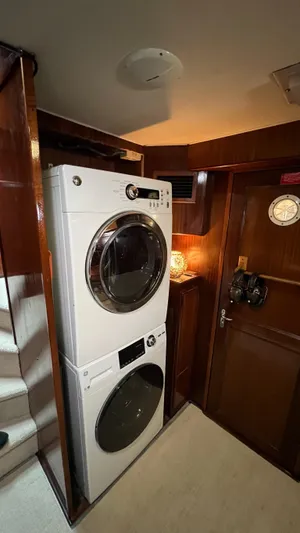 Sea Owl Yacht Photos Pics Stacked washer and dryer in 1987 Hatteras Motoryacht interior.